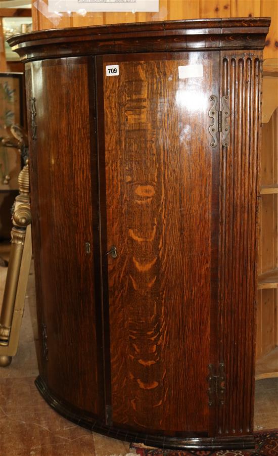 Oak bow fronted corner cupboard